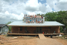 Rural Studio students on roof of Rose Lee's house.