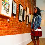 A UA student views the show “React” at the Paul R. Jones Gallery in downtown Tuscaloosa.