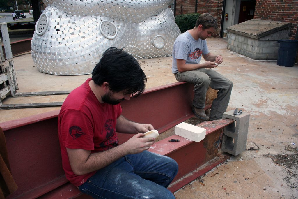 Patrick O'Sullivan and Mike Eddins carving cuttlefish molds for the aluminum pour.
