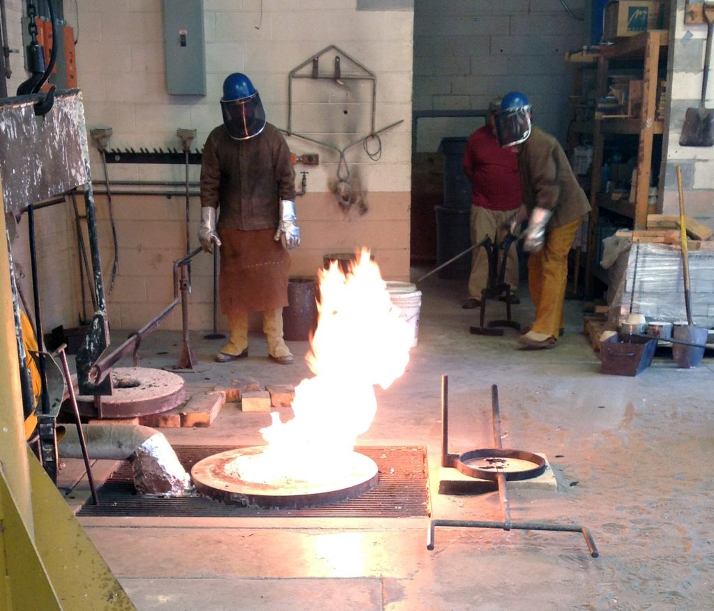 Aluminum pour in the foundry with Mike Eddins and Patrick O'Sullivan.