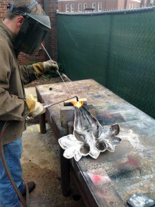 Mike Eddins brazing a cast iron leaf finial from Clark Hall.