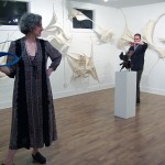 The artist Claire Lewis Evans among her sculptures.