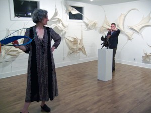 The artist Claire Lewis Evans among her sculptures.
