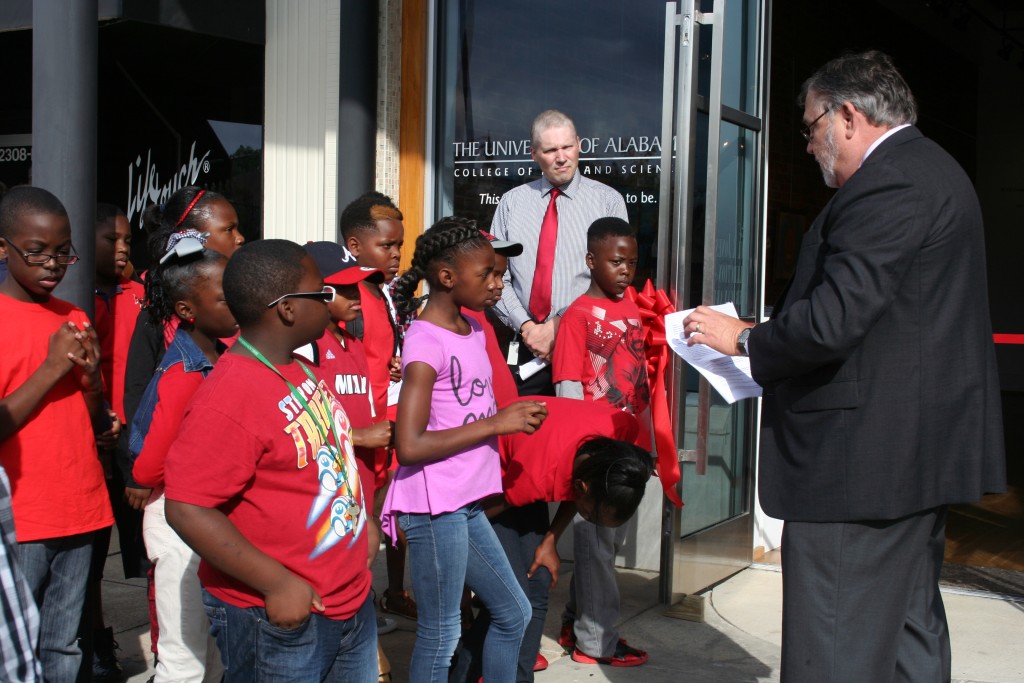Dean Robert Olin talks with middle and elementary kids at the Paul Jones Gallery.
