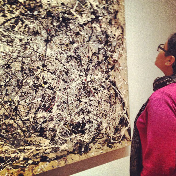 Dr. Wendy Castenell views Jackson Pollock's painting, "Number 1A, 1948" at the Museum of Modern Art in New York.