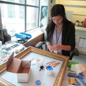 Erin Hein restores a frame during her internship at the RISD Museum Conservation Department.
