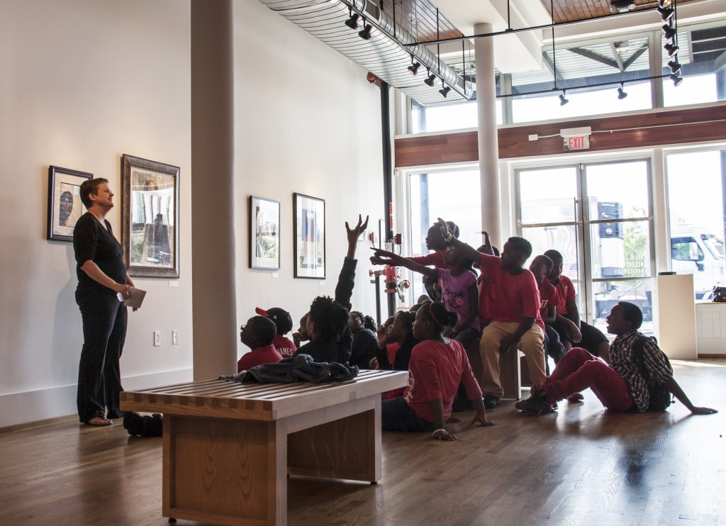 Dr. Lucy Curzon talks with K-12 students from Tuscaloosa City Schools visiting the Paul R. Jones Museum.