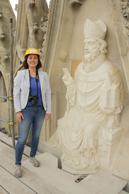 Dr. Jennifer M. Feltman with newly installed sculpture of St. Peter, east end, Yorkminster.