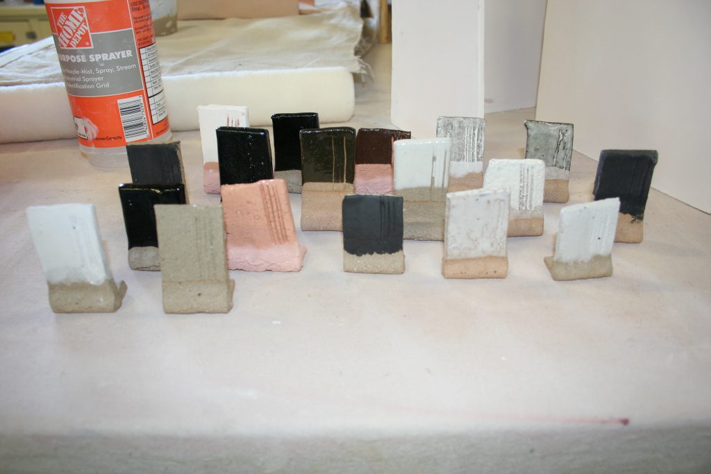 Clay test "tabs" allow artists to see how different glazes will appear after firing.