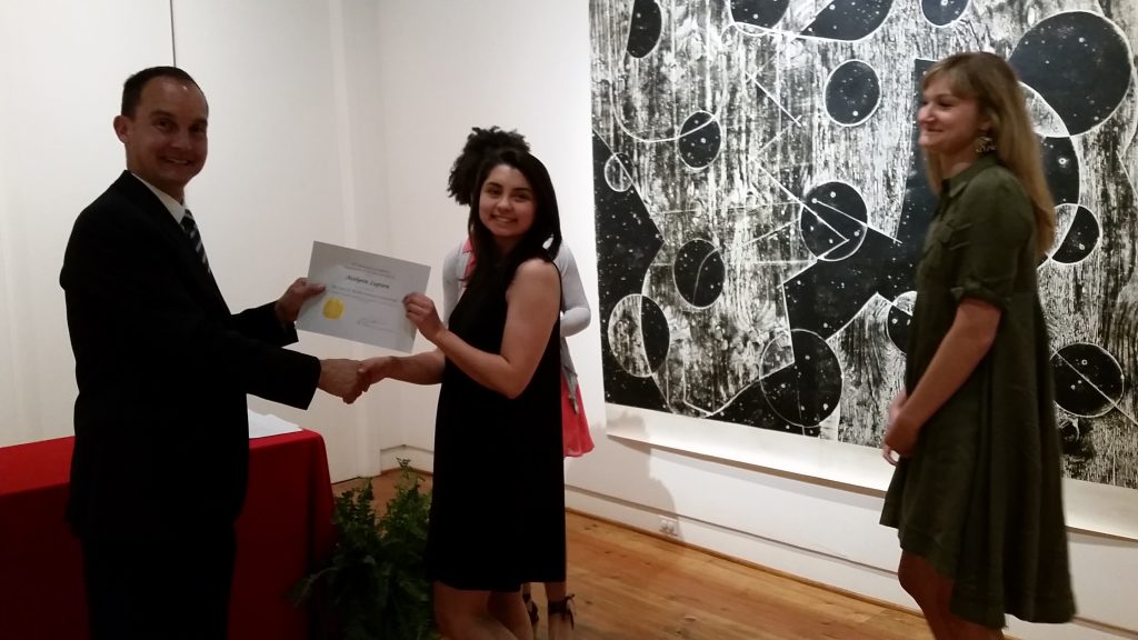 Aislynn Lupien receiving a scholarship award.