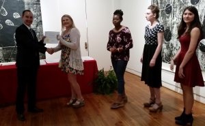 Jordan Hadley receiving a scholarship award.