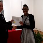 Kassidy Stewart receiving a scholarship award.