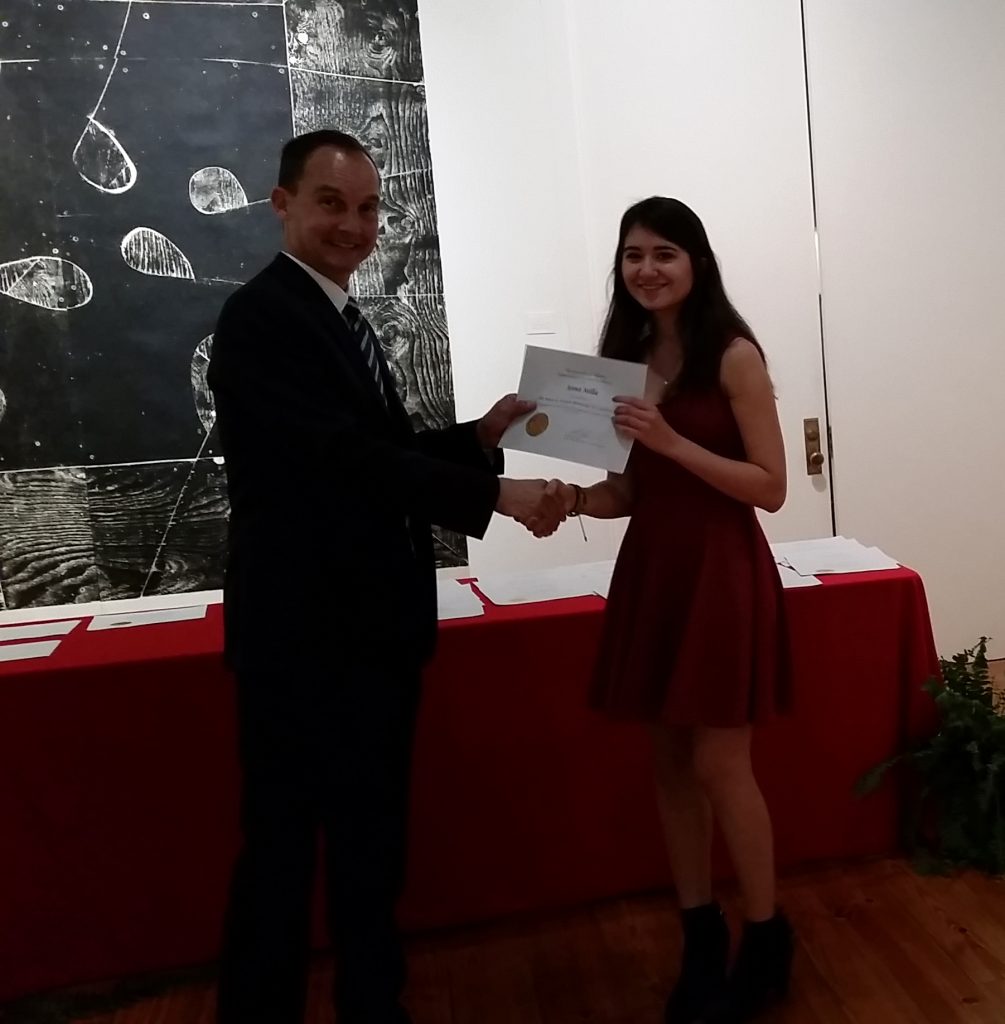 Anna Sella receiving a scholarship award.