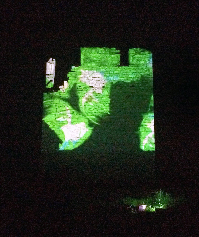 Multi-colored projection-mapped onto O'Brien's Castle on Inis Oírr by Jane Cassidy.