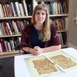 Graduate student in art history Reed O’Mara studies a reproduction of the Uta Codex in the rooms of the Price Collection in Garland Hall.