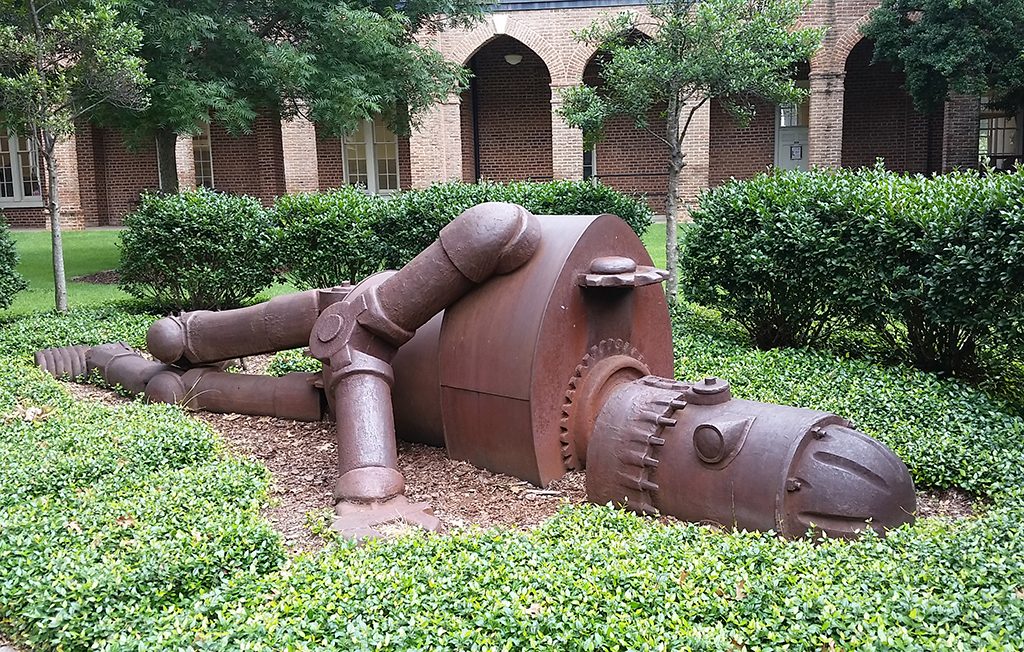 a sculpture that looks like a giant robot fallen on its side