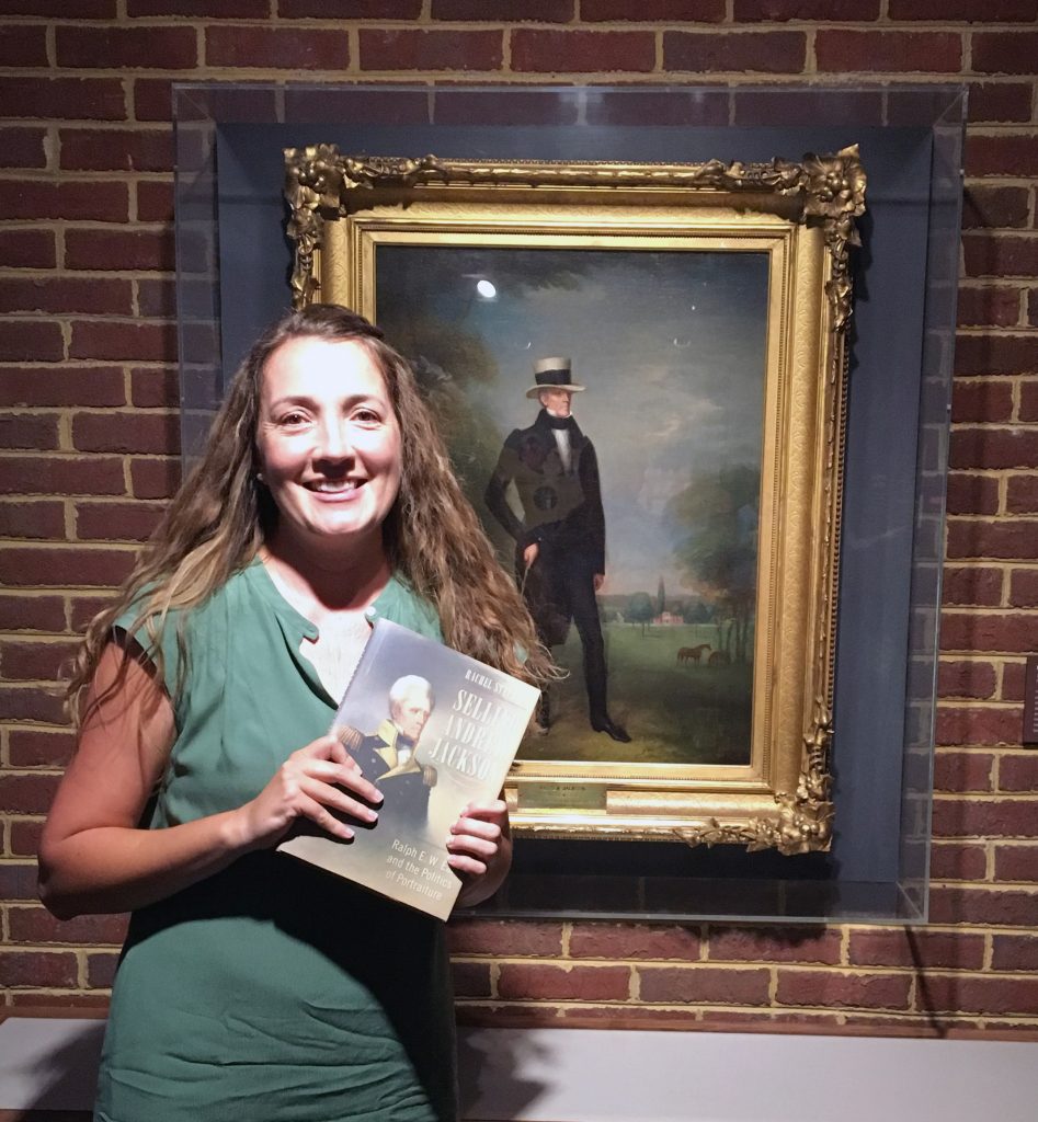Dr. Rachel Stephens at the Hermitage, standing before a portrait of Andrew Jackson by Ralph Earl, the subject of her new book.