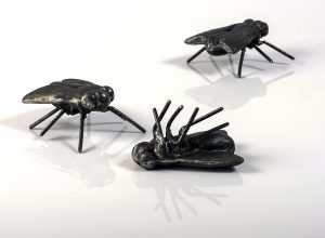April Livingston, Three Flies, 2016, cast iron and steel, each fly is 3 inches x 4 feet 7 inches