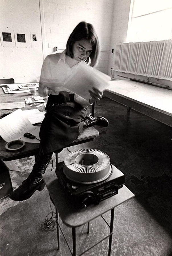 Photo of Professor Gay Burke preparing for class, taken by an unknown student, in the 1970s.