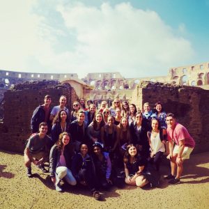 Study Abroad with UA Art in Italy, group photo at the Colosseum in Rome.