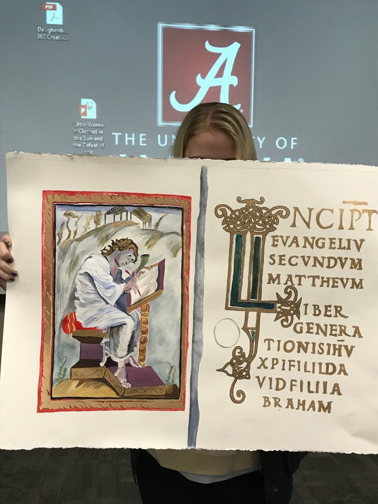 Victoria Andry with her version of St Matthew writing folios in the Ebbo Gospels, for Dr. Jennifer Feltman's ARH 360.