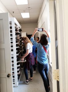UA alumna Emily Thomas, head of the Booker T. Washington Magnet High School photography program, takes pics of her students in Woods Hall.