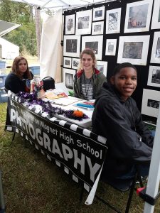 Booker T. Washington Magnet High School photography students welcome visitors at their booth at the 47th Kentuck Festival.