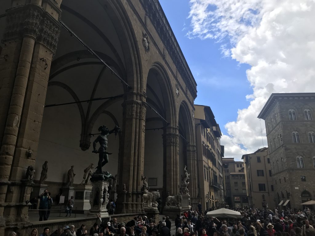 View of the Logia dei Lanzi with Benvenuto Cellini's "Perseus with the Head of Medusa" in Florence from the Palazzo Pubblico. Study Abroad, 2018. Photo courtesy of Rebecca Teague.
