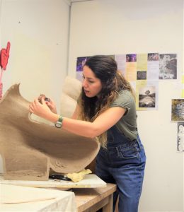 Graduate student Nasrin Iravani working on a ceramics piece for her MA exhibition, 2019. Image courtesy of the artist.