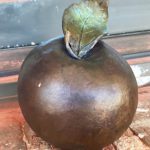 Josh Dugat’s bronze sculpture of an apple honors author and educator Marva Collins in the Monroeville Literary Capital Sculpture Trail.