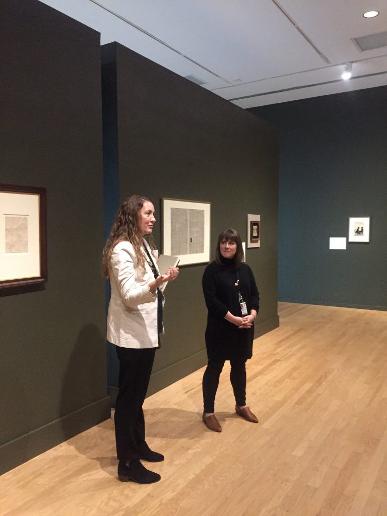 Two art historians talk about the museum exhibition.